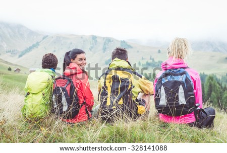 Group of hikers watching the scene in the fog. concept about sport, activity, friendship and people