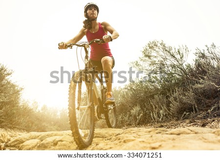 Young woman making downhill with her mountain bike. concept about sport and people