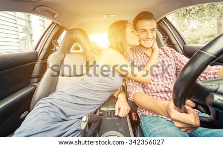 Happy couple driving on a sport car. Concept about transportation and love