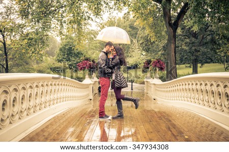 Lovely couple in Central park, New york under the rain