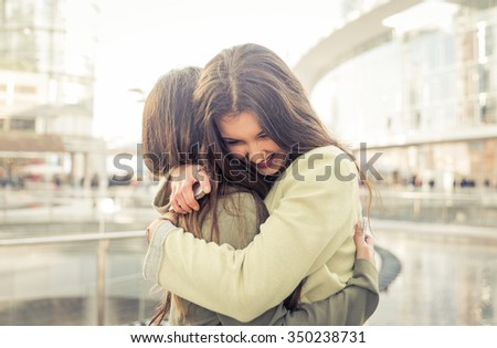 Two girls hugging each others after long time they have been distant