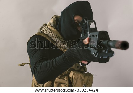 Terrorist sniper shooting with his weapon. Concept about terrorism