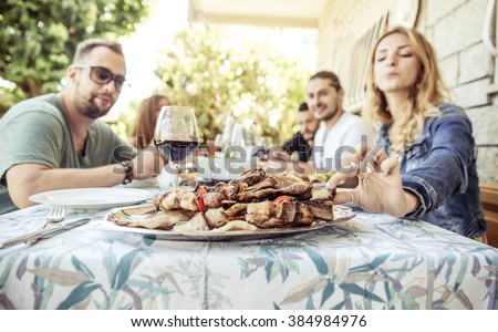Group of friends making barbeque in the backyard. concept about good and positive mood with friends