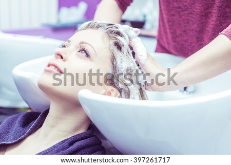 woman make shampoo at the hairdresser. concept about beauty and women
