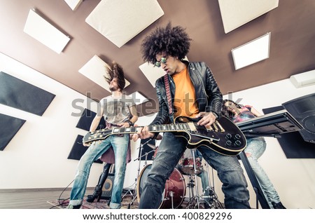 Rock band playing hard rock in the studio. Concept about entertainment and music
