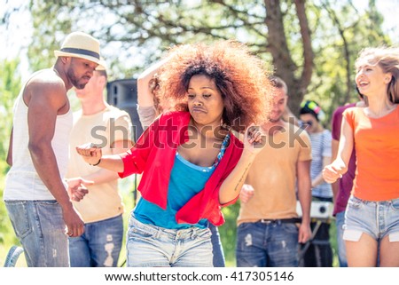 Group of friends dancing at a party