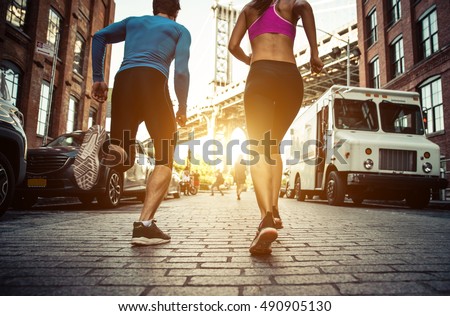 Couple running in Brooklyn. Urban runners on the move in New york