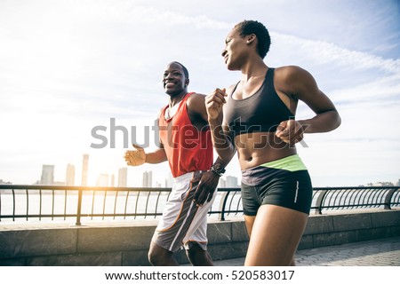 Couple running in New York - Sportive man and woman training outdoors
