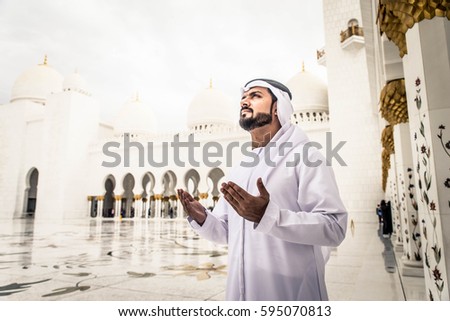 Arabian man at Sheikh Zayed Grand Mosque in Abu Dhabi, United Arab Emirates.