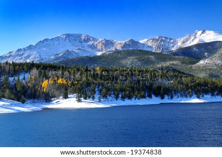 stock photo Snow capped Pikes Peak at Crystal Reservoir with a touch of