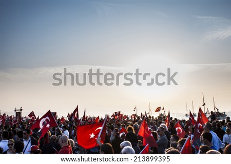 Republic day of Turkey.People have  Turkish flasg on their hands.Gundogdu Square October 29 2013.Izmir Turkey