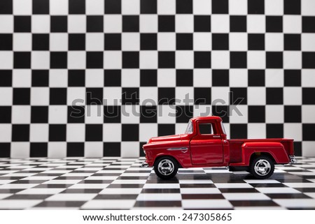 Chevrolet 3100 pickup toy car product shot on checkered background. Chevrolet is a automobile manufacturer. Owner is General Motors Company. Shoot date and location: Turkey - Izmir. January 24 2015