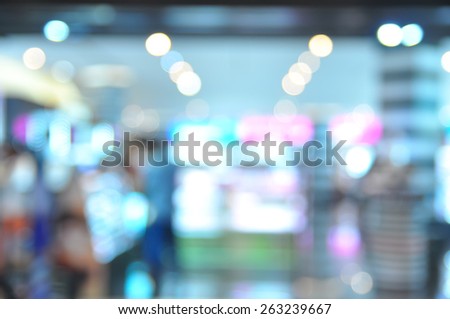 Blur image of people at make up store