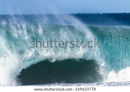 Ocean Wave Large Crashing Large ocean wave swell pitching and crashing hard with power and energy on shallow sandbar