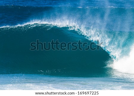 Ocean Waves Crashing  Ocean wave swell surging forward and crashing onto shallow beach sandbars with energy and power