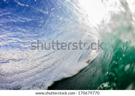 Inside Crashing Wave Inside hollow crashing wave with distant tube light exit