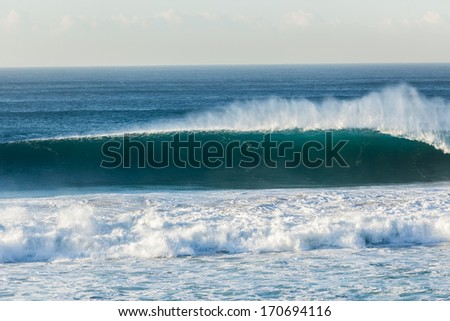 Wave Wall Upright Blue Ocean blue wave wall of water upright crashing onto shallow reefs
