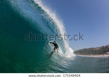 Surfing Inside Hollow Blue Wave Surfer tube riding inside hollow blue crashing wave