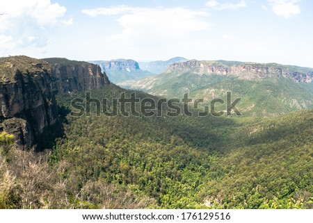 Mountain Rocky Ridge Valley Landscape Birds eye view overlooking rocky mountain ridge into the wilderness forest lands into the horizon