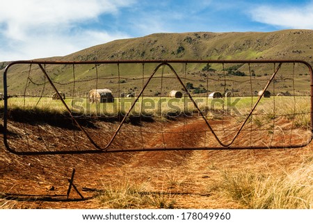 Mountains Farm Field Bales Rural farm field in the mountains with fresh cut grass cattle feed bales scattered over the colorful landscape