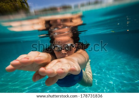 Girls Underwater Summer Playtime Girls underwater swimming pool having fun summer playtime