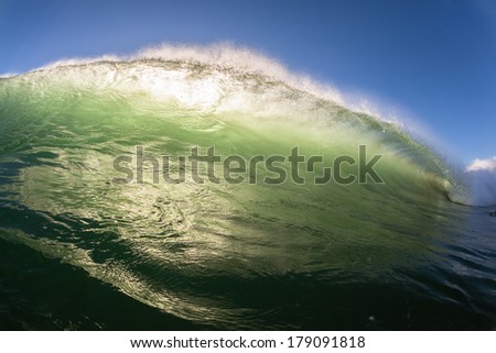 Wave Water Colors Crashing Ocean Wave upright wall of sea water surging crashing onto shallow sandbars
