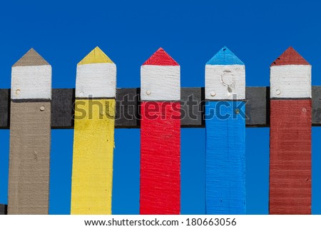 Wood Fence Colors Section Wood fence section detail painted pastel colors against blue sky