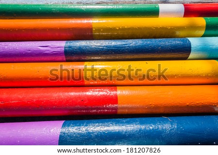 Wood Poles Equestrian Colors Wood poles painted in pastel bright colors used for equestrian jump fence gates in course arena