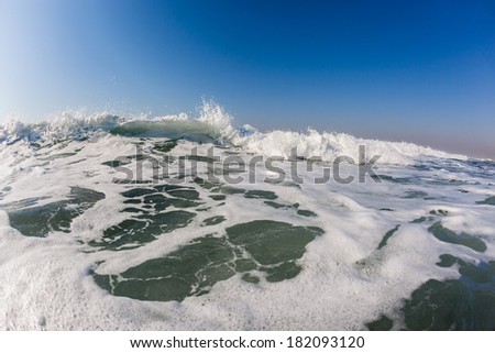 Ocean white water wave Ocean wave white water rushing towards shallows with power energy of nature