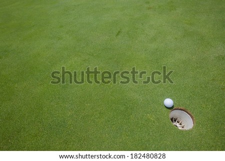 Golf Putting Green Ball Hole Golf putting green with ball hole next to hole