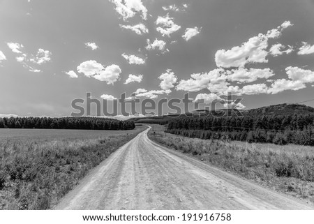 Dirt Road Horizon Black White Dirt road mountain landscape in black and white contrast of nature