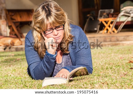 Woman Reading Book Outside