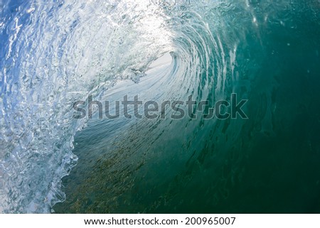 Inside Out Hollow Wave Tube Swimming Closeup swimming inside waters of hollow wave tube crashing breaking on shallow sandbar