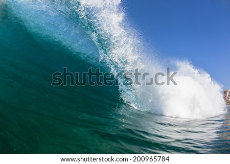 Crashing Blue Wave Water Closeup Swimming Closeup swimming inside ocean wave crashing breaking blue water on shallow sandbar
