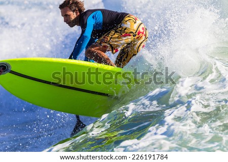 Surfing Rider SUP Action Surfing sup surfer rides ocean wave closeup action