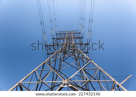 Electrical  Cables Tower Blue Electrical high voltage powerlines tower metal structure attached cables in blue sky