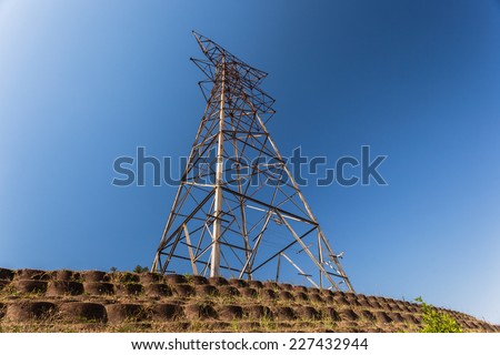 Electrical Tower Stripped  Electrical  tower metal structure stripped of power cables bare in blue sky