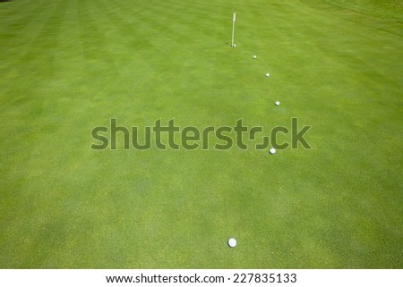 Golf Putting Green Balls Golf practice putting green with balls on predicted line