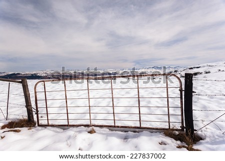 Gate Fence Snow Mountains Gate fence on  high plateau mountain terrain in winter snow scenic landscape
