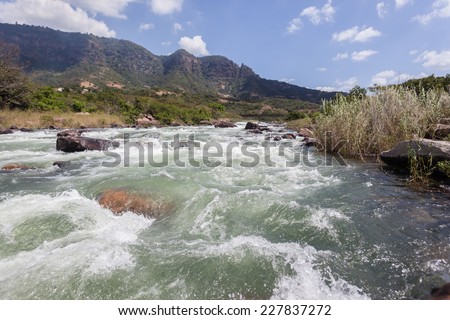 River Rapids Water Valley River rapids rocks and fast flowing water power and energy of nature through tropical valley
