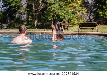 Teen Boy Girl Swim Pool Hangout Teenagers girl boy swim pool hangout summers day home talk laugh playtime