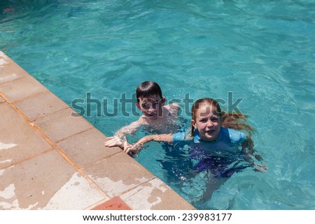 Boy Girl Swim Pool Boy girl swimming pool  home summer playtime