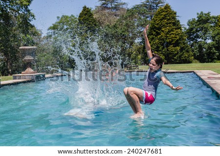 Girls Jumping Pool Girls teenagers jumping into swimming pool home summer
