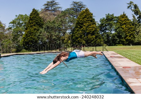 Girl Diving Pool Girl teenager diving into swimming pool home summer