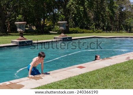 Boy Girl Pool Summer Boy girl swim pool home summer playing holidays