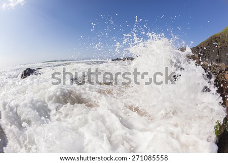 Wave White Water Rocks Ocean wave white water shore break crashing into rocks along beach