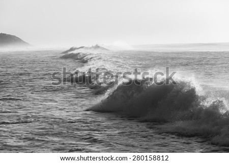 Wave Water Power Black White\
Ocean crashing waters power in black and white along beach coastline,