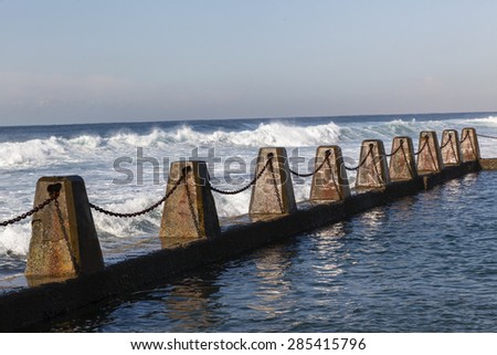 Ocean Pool Blocks Chains\
Tidal Pool ocean waves concrete blocks safety chains.