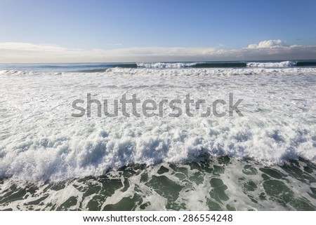 Ocean Waves Landscape\
Ocean waves distant crashing breaking rolling towards beach
