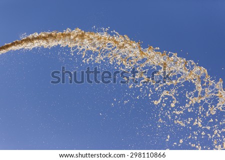 Water Falling Blue Background\
River Water pressure pumped volumes sprayed falling across blue sky abstract